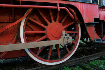 Red wheel of a heavy locomotive