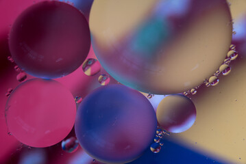 Abstract shot of colored oil stains in water