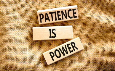 Patience is power symbol. Concept words Patience is power on beautiful wooden blocks. Beautiful canvas table canvas background. Business and patience is power concept. Copy space.
