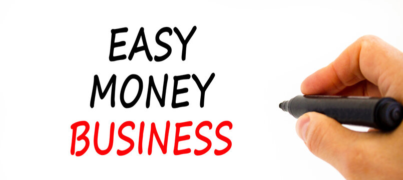 Easy money business symbol. Concept words Easy money business on beautiful white paper. Beautiful white table white background. Businessman hand. Easy money business concept. Copy space.