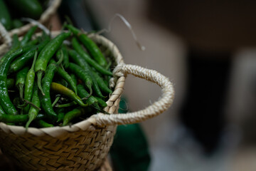 sample of green chillies in a basket