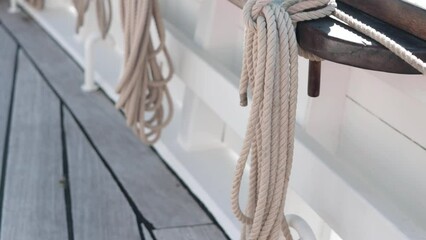 coils of ropes on board a sailing yacht. view from the deck of the boat.