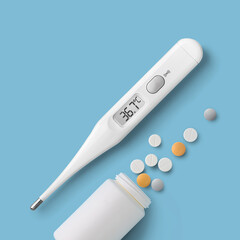 Electronic thermometer and pills on blue background directly above