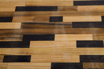 a wooden floor with a black and white pattern