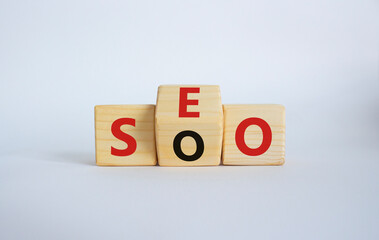 SEO vs SOO symbol. Wooden cubes with words SOO and SEO. Beautiful white background. SEO vs SOO and business concept. Copy space