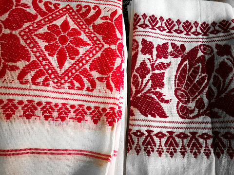 Gamosa or gamusa is a traditional textile pattern from Assam. It is a white piece of cloth with red stripes and red motifs, which is used in Bihu and resembles Ukrainian and Russian patterns.