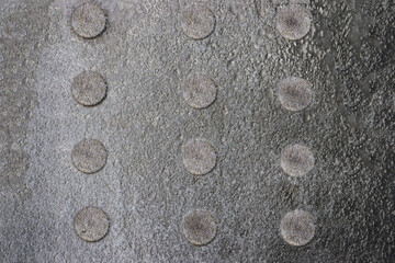 Abstract background from a gray metal surface.