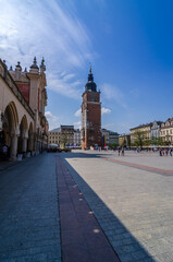 Fototapeta na wymiar Main market square, Krakow, Poland filled with tourist on warm spring day.