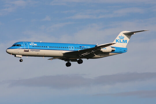 Schiphol, Netherlands - August 2, 2008: Dutch KLM Cityhopper Fokker 100 with registration PH-OFM on final for Amsterdam Airport Schiphol
