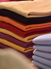 stack of colorful clothes in a boutique