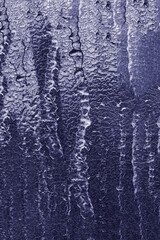 Vertical photo of frozen water leaks.