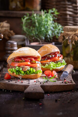 Delicious and spicy sandwich with pate, tomato and lettuce.