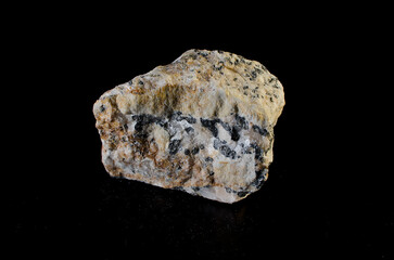 Cerussite stone mineral on black background.