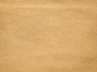 Fototapeta premium old khadi fabric texture background. light natural linen texture for the background.Golden yellow linen fabric of table cloth texture background.