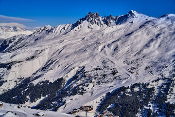 Breathtaking beautiful panoramic view on Snow Alps - snow-capped winter mountain peaks around...