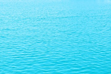 blue water ripples panorama background. water blue background with soft waves.