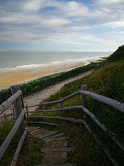 Fototapeta na wymiar path with wooden border going down to Villerville beach in Normandy