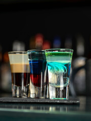 multi-layered cocktail shots at the bar