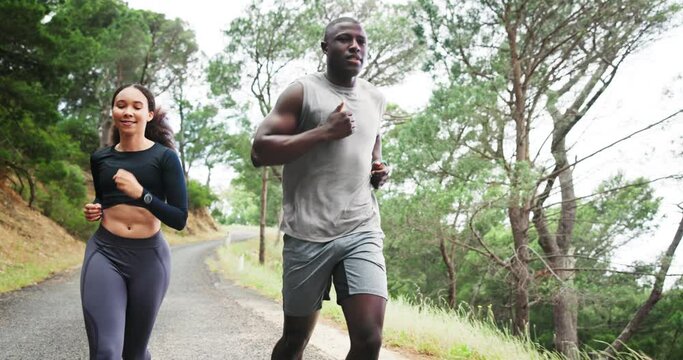 Man, woman and running on mountain or exercise with personal trainer for fitness, performance or cardio. Athlete, outdoor and hill challenge in nature or workout practice as sport, health or wellness