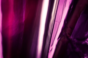 Pink and purple abstract shiny foil background texture