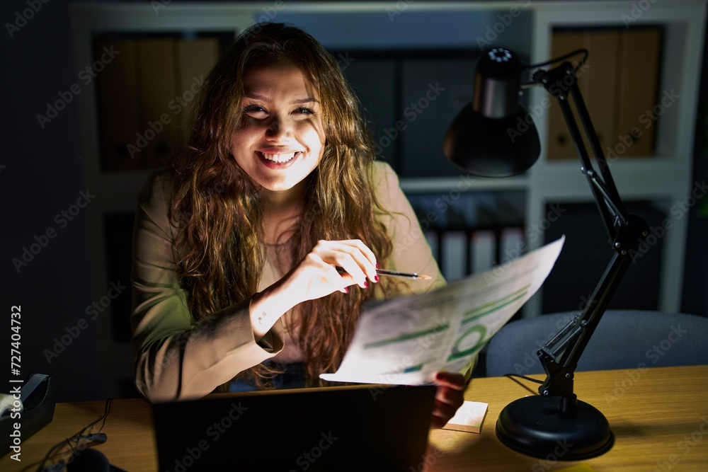 Canvas Prints Young beautiful hispanic woman business worker using laptop reading document at office