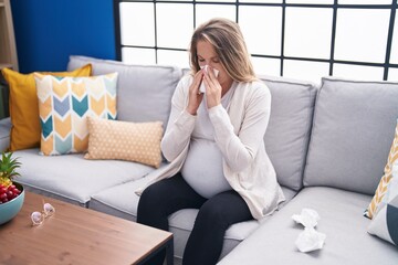 Young pregnant woman illness using napkin at home