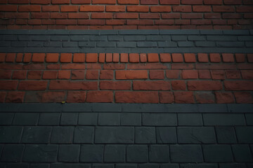 A wall of red and gray bricks