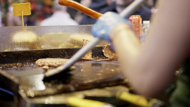 Lady cleaning griddle