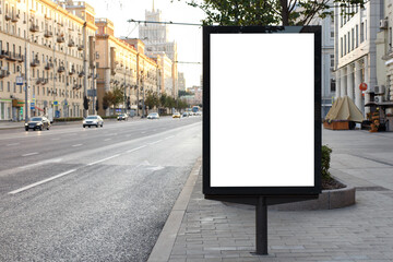 Vertical billboard advertising in the city. The day begins. Mock-up.