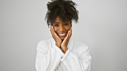 African american woman wearing bathrobe massaging face over isolated white background