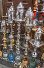 hookahs, shishas, or waterpipes for sale on busy Moez Street in Fatimid or Medieval Cairo, Egypt 
