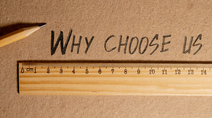 Why choose us symbol. Concept word Why choose us on beautiful white paper.