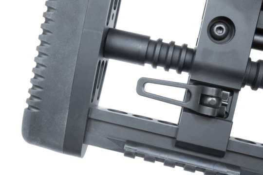 Lever at the recoil pad to adjust a rifle stock