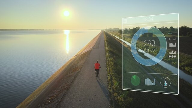 Cyclist tracks his training development Heart rate and distance using a digital tracking device screen