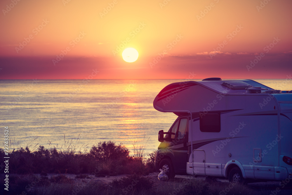 Sticker caravan on sea at sunrise.