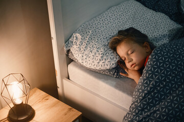 Child sleeping at night. Comfortable bed for kids. Toddler girl sleeping tight, fast falling...