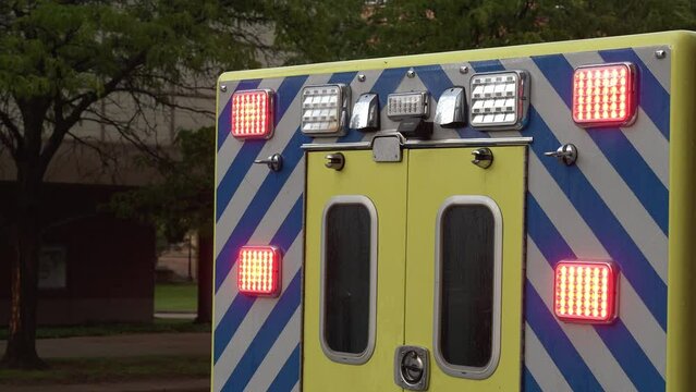 EMS EMT Ambulance Green emergency vehicle with flashing lights and sirens