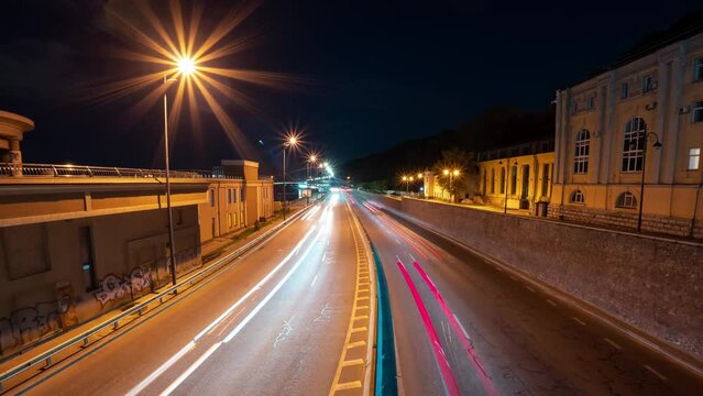 Timelapse of a busy city highway at night with beautiful bokeh lights