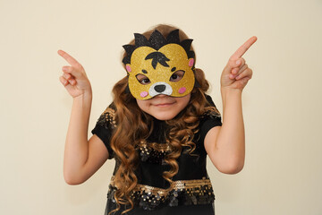 A child in a masquerade carnival mask of a hedgehog, hand-made from glitter foamiran. Little cute...