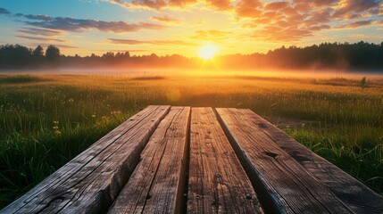 Weathered wooden planks set against misty meadow bathed in the warm glow of sunrise, wildflowers...