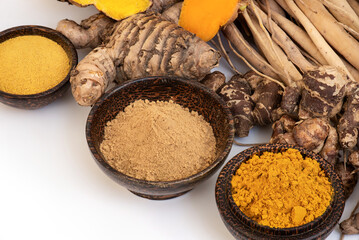 Shatavari or Asparagus racemosus roots and other herbs isolated on white background.