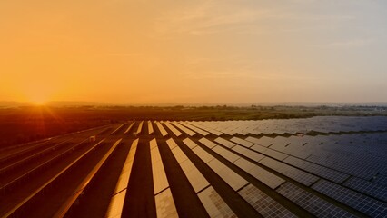 Drone view of solar panels in sunset time