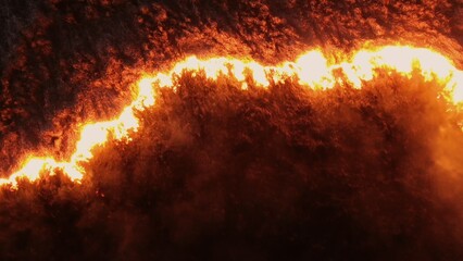 Aerial video of a fire on a dry field at night