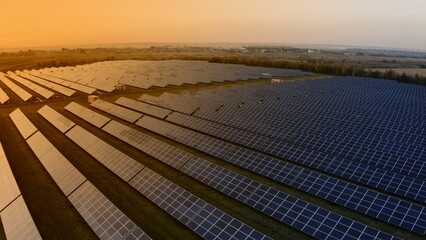 Aerial View of High-Efficiency Solar Power Installation at Sunset