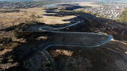Aerial survey of fields and settlements after a large fire