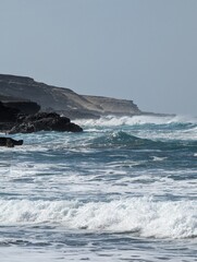 waves crashing on rocks