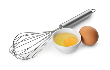 Whisk, whole and broken eggs isolated on white