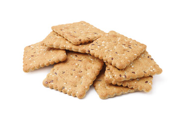 Pile of cereal crackers with flax and sesame seeds isolated on white