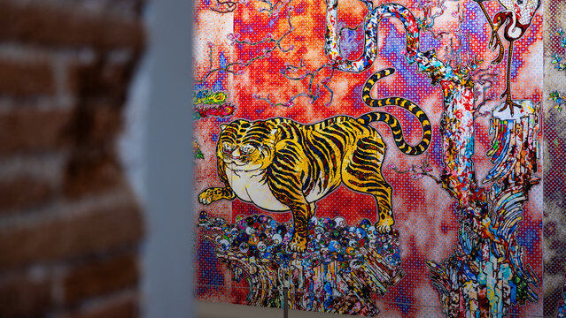 Barcelona, Spain - April 11 2023 : Artwork by Takashi Murakami in the Mono Museum Gallery in the Gothic Quarter. Artwork of lion using Nihonga  Japanese painting technique. vibrant horizontal picture