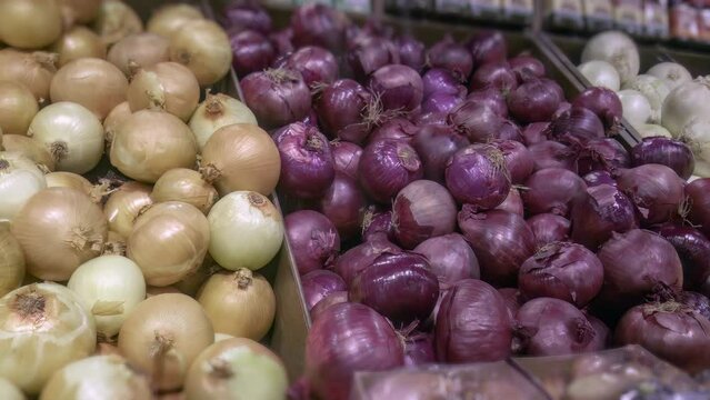 onions at grocery store fresh food market purple yellow and white variety